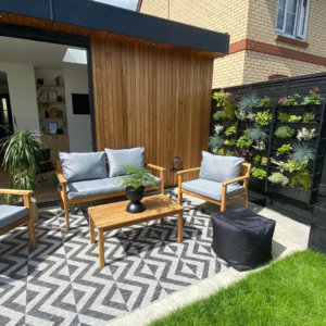a living wall with an entertainment space and outdoor seating